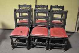 A set of six carved oak dining chairs