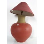 A painted pottery table lamp in the form of a round urn