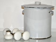 A group of porcelain door handles and an enamel bin