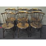 A set of six stick back chairs