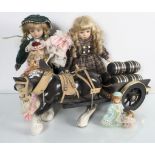 A Shire horse and cart, and three dolls