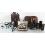 A pair of opera glasses, miniature radio and a pair of binoculars