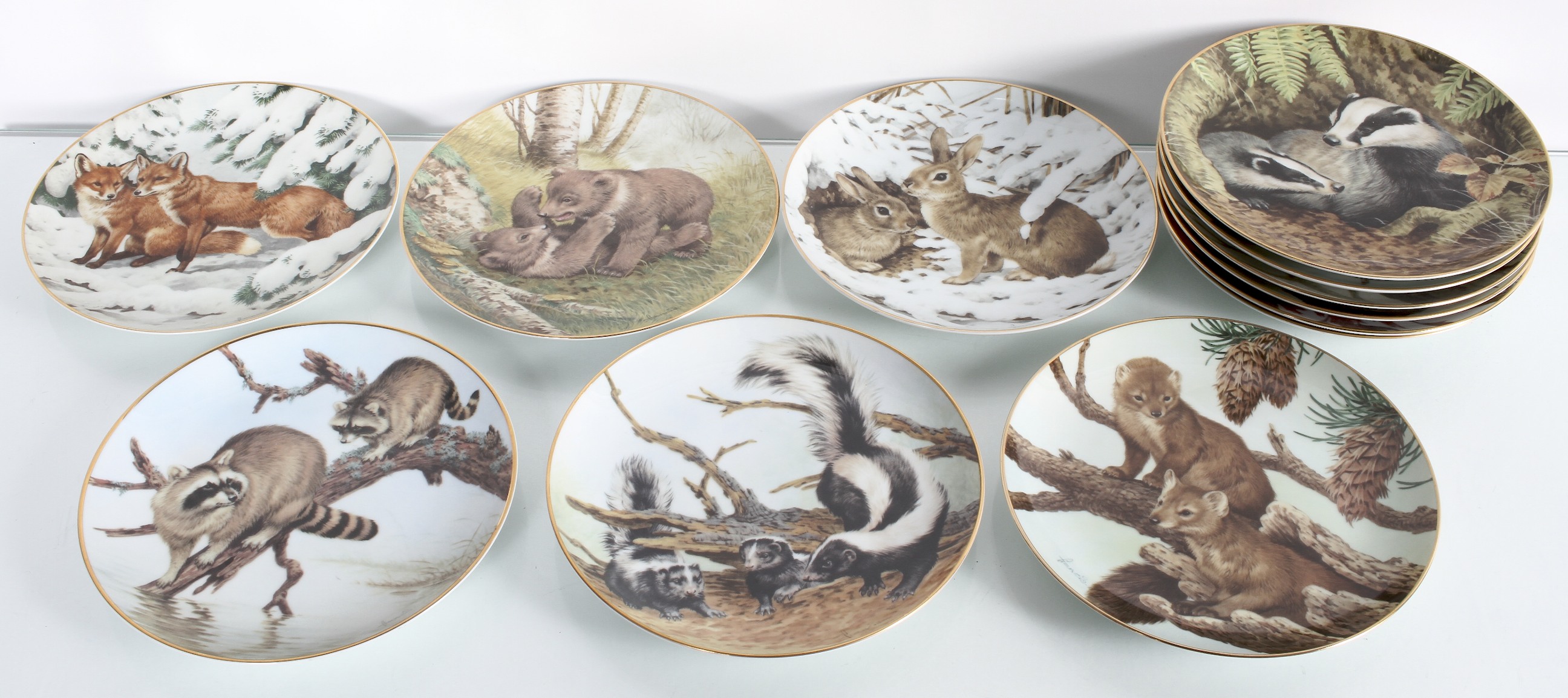 A group of wall plates the forest year by the collectors studio depicting wildlife 19cm