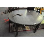 A wind out dining table with one leaf and winder H 70cm,