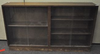 A glazed cabinet H 77cm, W 138cm,