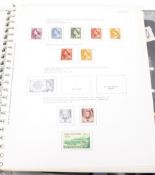 An Australian stamp album from 1952, partly filled,