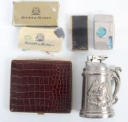 A group of lighters and a cigarette case