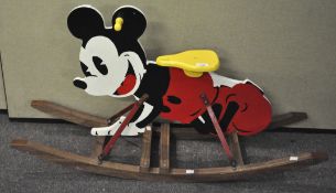 A Mickey Mouse rocking toy