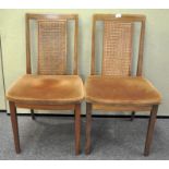 A pair of G-plan chairs with bergere splat backs over upholstered seats 86cmH