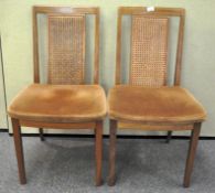 A pair of G-plan chairs with bergere splat backs over upholstered seats 86cmH