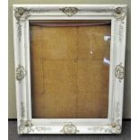 A white painted display frame with gilt highlights 117 x 95 cm