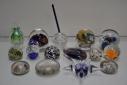 A collection of glass paperweights