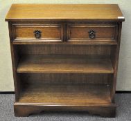 An oak hall cupboard with two shelves and two drawers 82 cm high