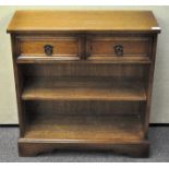 An oak hall cupboard with two shelves and two drawers 82 cm high