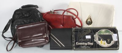 A group of ladies bags to include a cream clutch bag