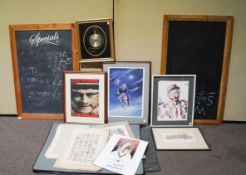 A framed quartz clock, two blackboards and various prints together with a large portfolio