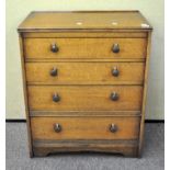 An oak chest of drawers 83 cm high
