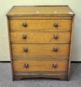 An oak chest of drawers 83 cm high