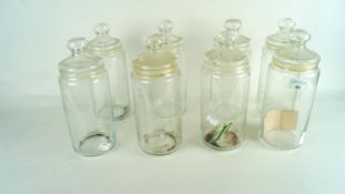 Eight glass lidded jars