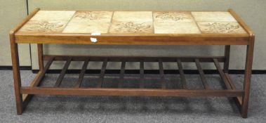 A tile topped coffee table 40cmH x 105cmW x 47cmD