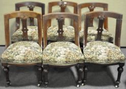 A set of six late 19th century oak dining chairs