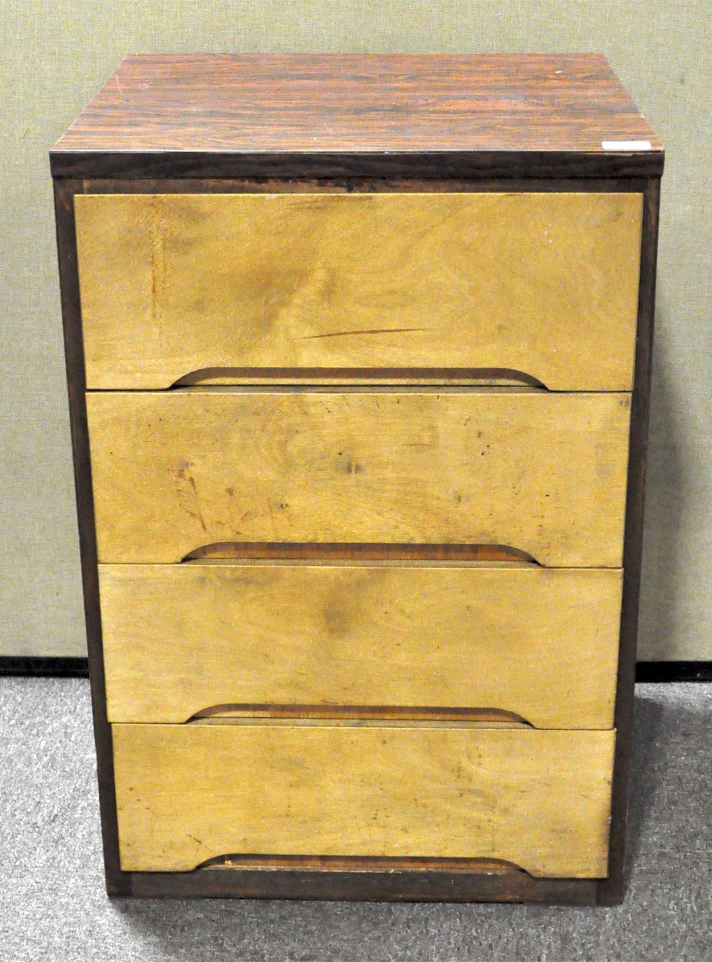 A formica topped four drawer cabinet,