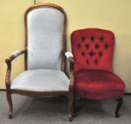 An armchair and another upholstered in blue and red velvet respectively