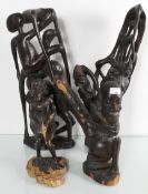 Four African carvings of dancers and musicians the tallest 63cm high