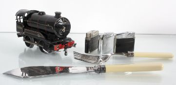 A Hornby locomotive, some tobacco pipes and other items including lighters