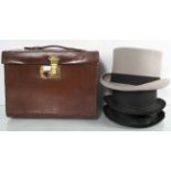 A top hat box complete with some top hats
