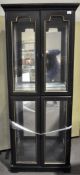 A four door glazed cabinet 182cm x 68cm