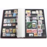A stock book of stamps with musical instruments and associated items,