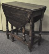 A mahogany hostess trolley with shaped drop leaf top and an oak table 73cmH x 96cmW x 106cmD