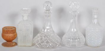 Four cut glass decanters,