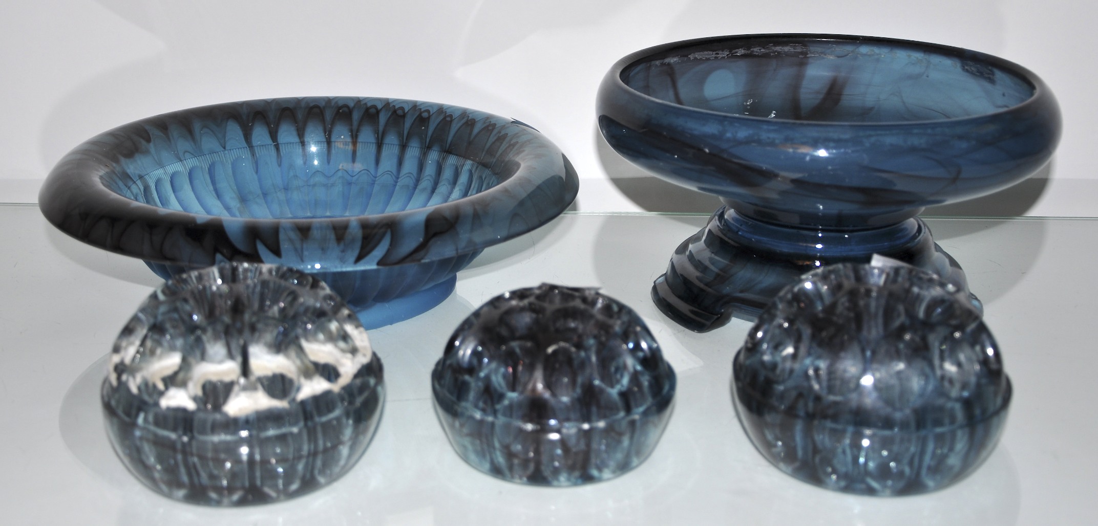 A blue glass bowl, three flower hedgehogs and a cut glass bowl