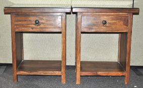 A pair of hardwood open based bedside tables, set a drawer and a shelf,
