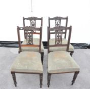A set fo four Edwardian mahogany chairs with vase splats. Measures; 86cm high.