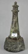 A 20th Century carved Cornish serpentine stone lighthouse. Measures; 32cm high.