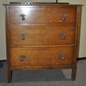 An Edwardian oak chest of drawers,