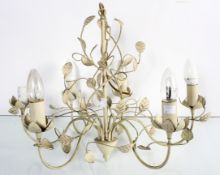 A toleware white painted metal chandelier decorated with foliage,