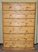 A pine chest of drawers,