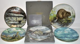 A collection of four limited edition Royal Doulton collector cabinet plates along with another