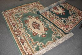 Two Persian style rugs, in bags,