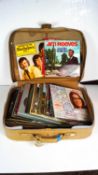 A suitcase containing records to include Jim Reeves and other 60's LPs