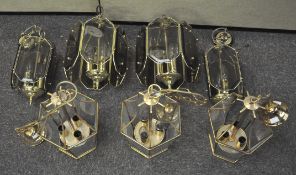 Two matching sets of brass and glass ceiling pendant lights. Largest measures; 37cm high.