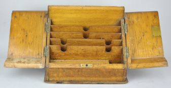 An early 20th Century oak stationery box / tidy. Measures; 26cm tall.