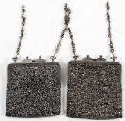 A pair of bright cut steel purse bags