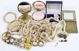 A group of simulated pearls and collection of compacts including Stratton