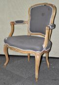 An upholstered beech armchair,