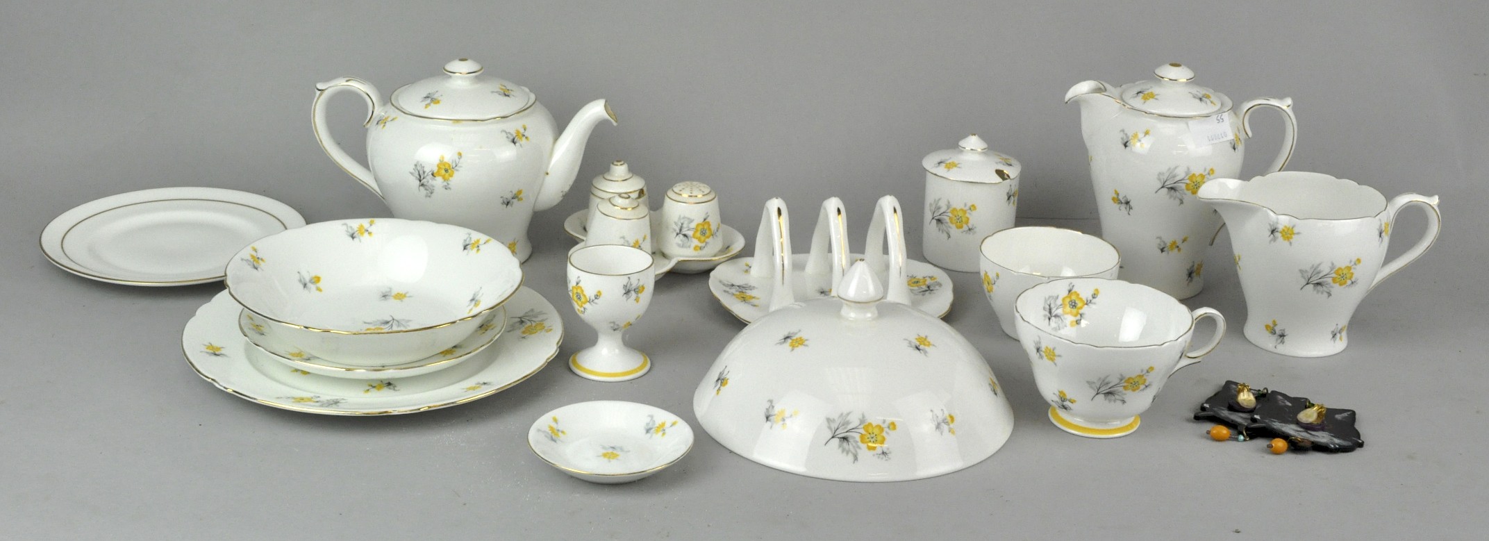 A 'Shelly Charm' tea set to include; toast rack teapot, cruet set, plates, cups and more.